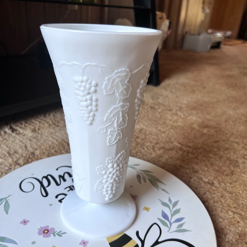 Vintage milk glass vase with a grapevine pattern, dating back to 20th century.